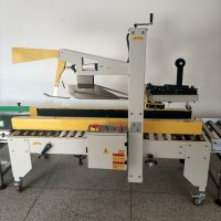 Rattling solution for box sealing machine